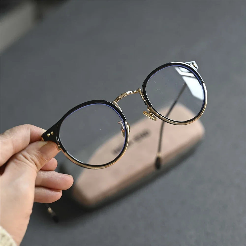 Cubojue Women's Full Rim Round Tr 90 Alloy Eyeglasses 522180