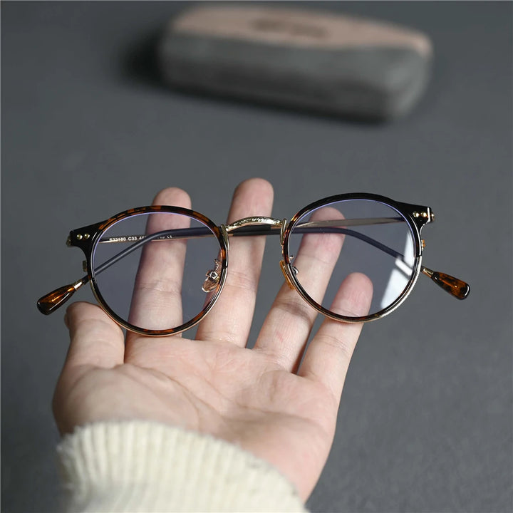 Cubojue Women's Full Rim Round Tr 90 Alloy Eyeglasses 522180