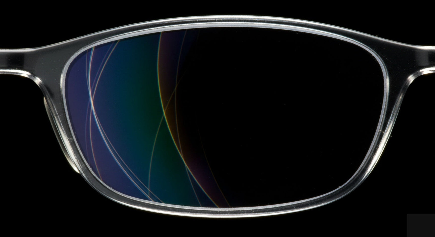 Macro close-up of HMC coating glasses lens with light refracting through multi-coat layers