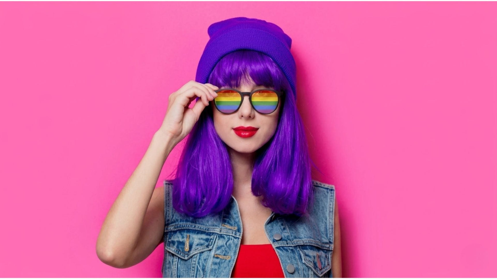 Woman with purple hair wearing bold  round glasses showing color psychology in eyewear