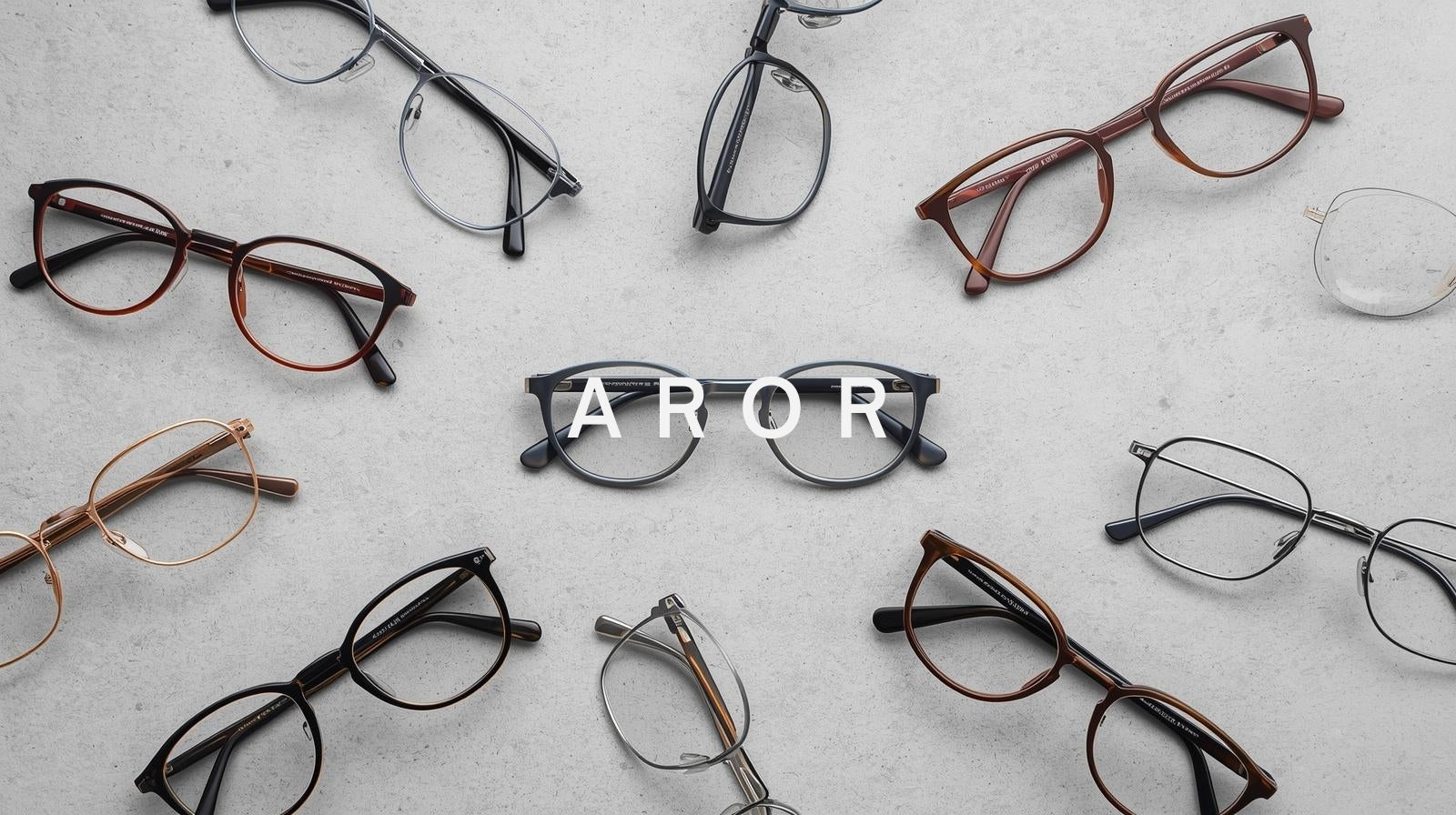 The FuzWeb Aror collection, a versatile range of durable and stylish eyewear for men and women, featuring titanium and acetate frames, including full-rim and trendy double bridge designs on a simple medium-grey background.