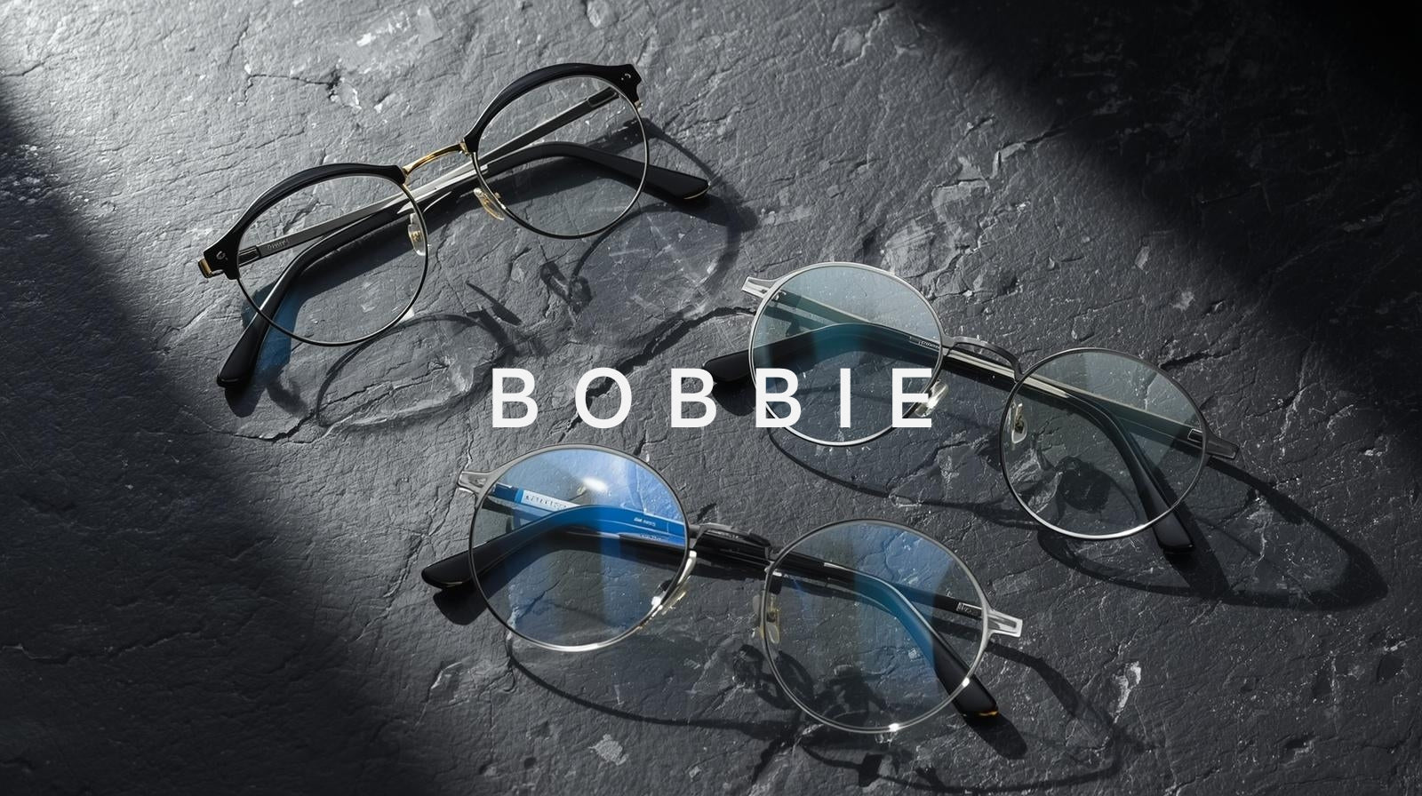 fuzweb Bobbie Lenses: paper-thin 1.67/1.74 high-index single-vision & bifocal lenses with anti-glare coating on dark slate. HD vision tech.