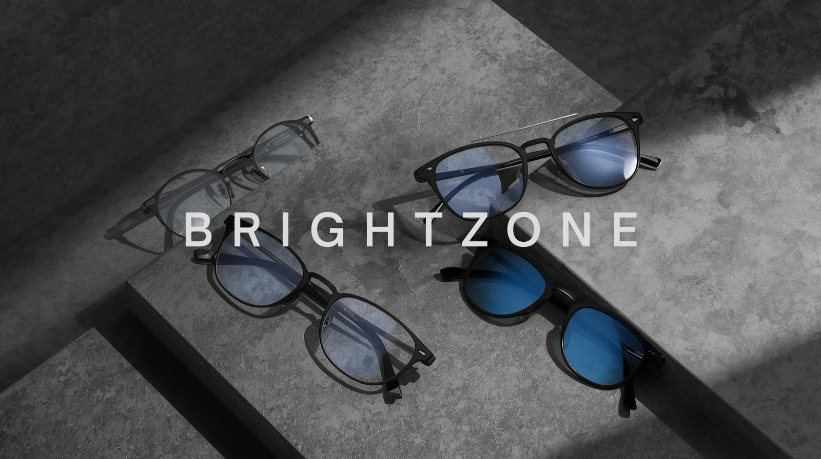 fuzweb Brightzone: titanium & Ultem full-rim and rimless frames with blue-light protection & clip-on sunglasses on medium gray.
