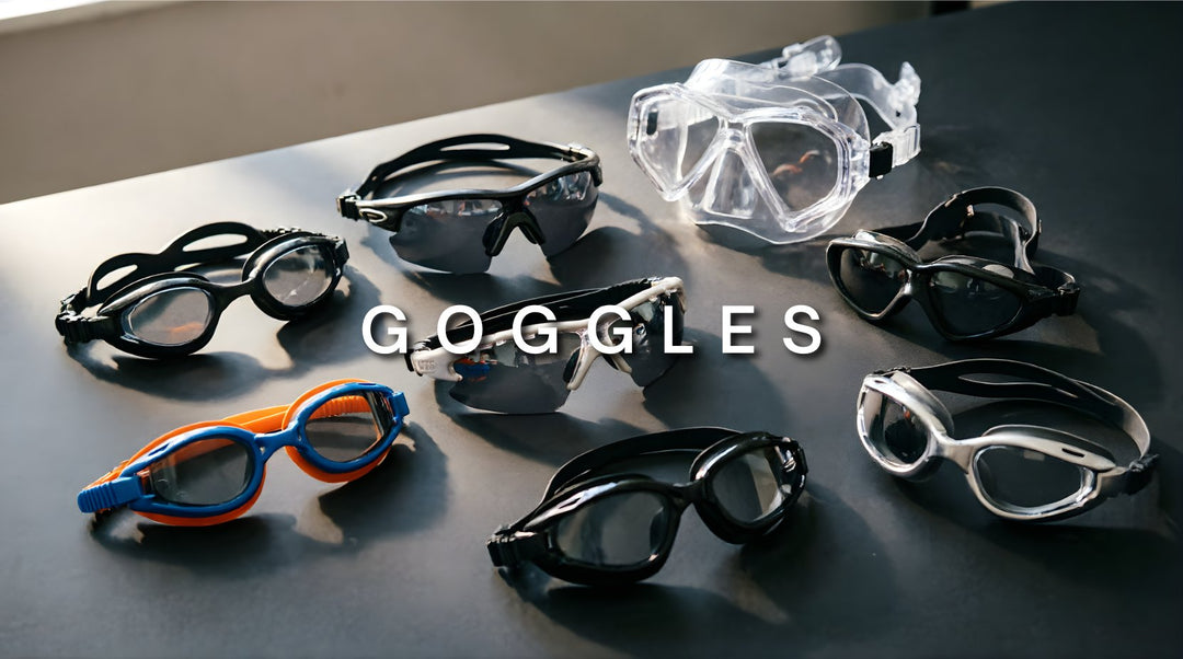 FuzWeb sports goggles collection featuring swimming goggles, running sunglasses, snorkel mask, and cycling protective eyewear on dark charcoal studio background with natural lighting