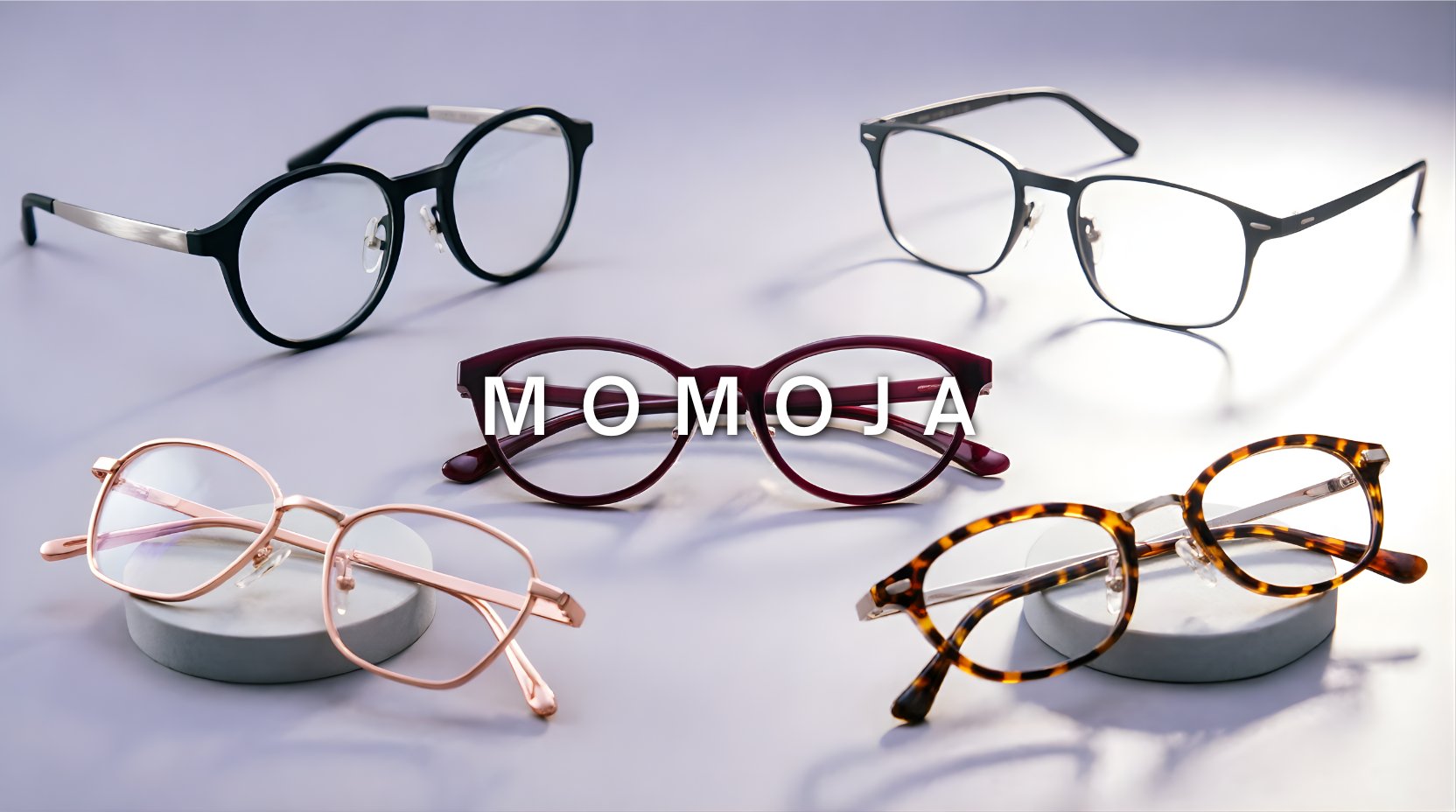 FuzWeb Momoja eyeglasses collection featuring titanium acetate frames in round square and cat-eye full rim and semi-rim styles on soft lavender-gray studio background with soft back-right lighting