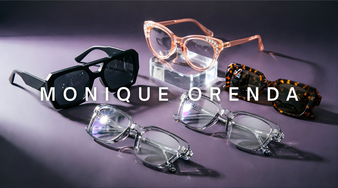FuzWeb Monique Orenda collection featuring steampunk cat-eye rhinestone and transparent acetate alloy sunglasses and eyeglasses on plum-purple gray studio background with soft side-left lighting