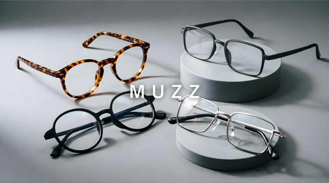 FuzWeb Muzz collection featuring titanium and acetate eyeglasses in round square and irregular styles on medium cool gray studio background with soft front-left lighting