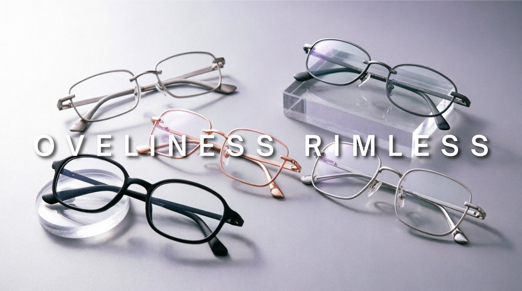 FuzWeb Oveliness rimless collection featuring titanium alloy eyeglasses in square oval irregular and round square screwless styles on silver-lavender gray studio background with soft back-left lighting