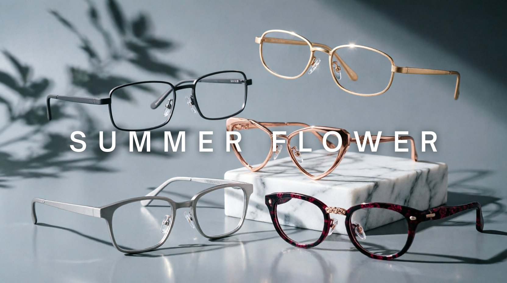 FuzWeb Summer Flower collection featuring titanium eyeglasses in square oval cat-eye semi-rimless styles with floral engraving on dove-gray studio background with dramatic side lighting