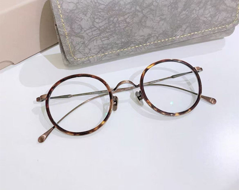 Aimee Womens Full Rim Round Acetate Titanium Eyeglasses 541139 — view 1 | Aimee at FuzWeb