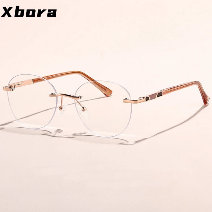 Xbora Women's Rimless Round Oval Alloy Tr 90 Eyeglasses 579008
