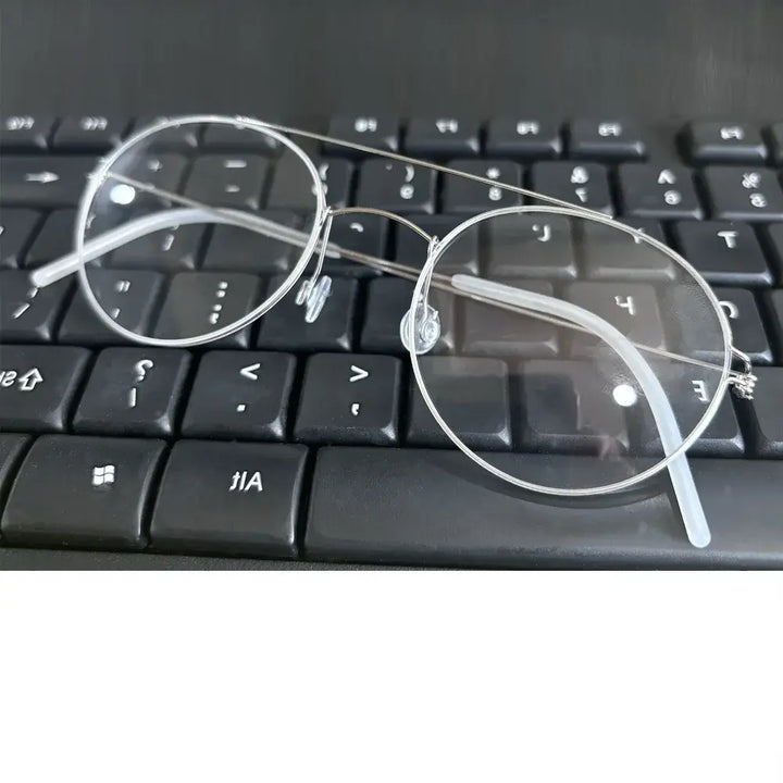 Bobbie 165342 Unisex 138mm Full Rim Oval Double Bridge Titanium  Frames — view 1 | Bobbie at FuzWeb