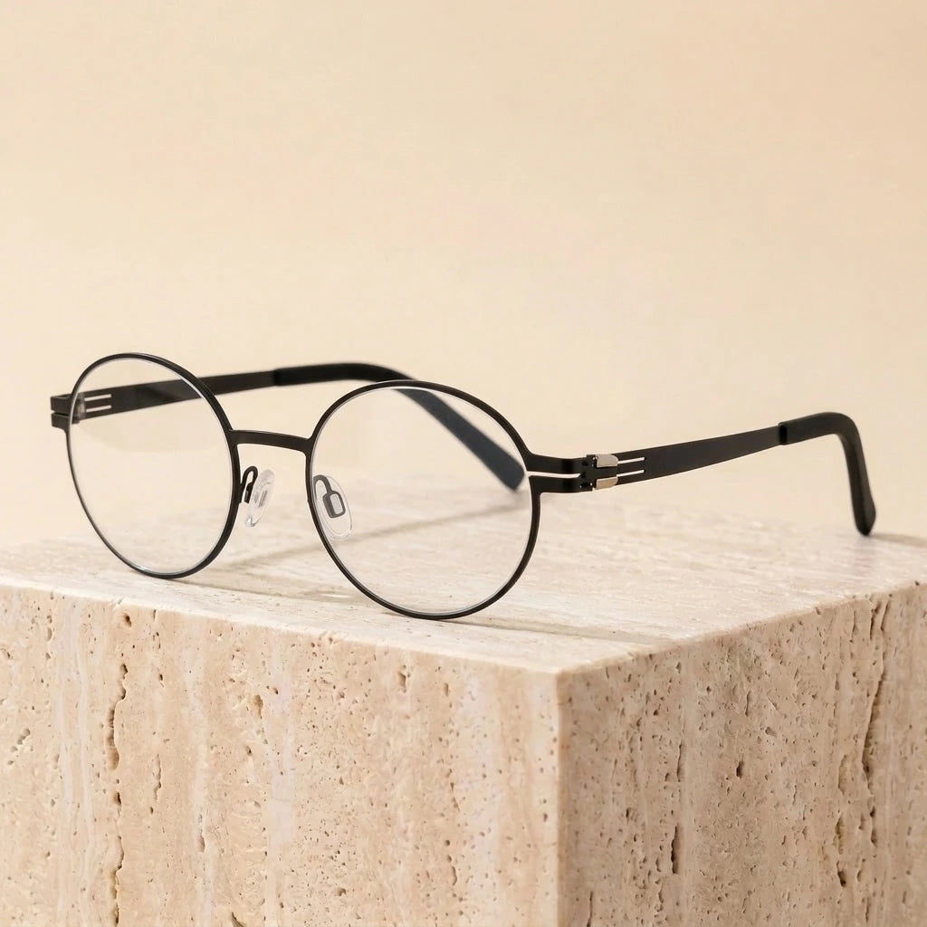Aimee Unisex Full Rim Round Screwless Stainless Steel Eyeglasses 2004 — view 1 | Aimee at FuzWeb