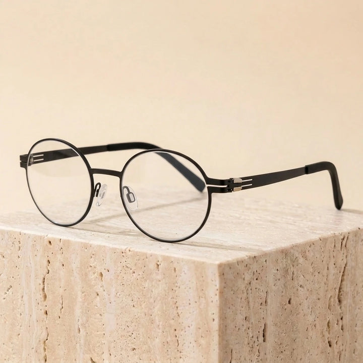 Aimee Unisex Full Rim Round Screwless Stainless Steel Eyeglasses 2004 — view 1 | Aimee at FuzWeb