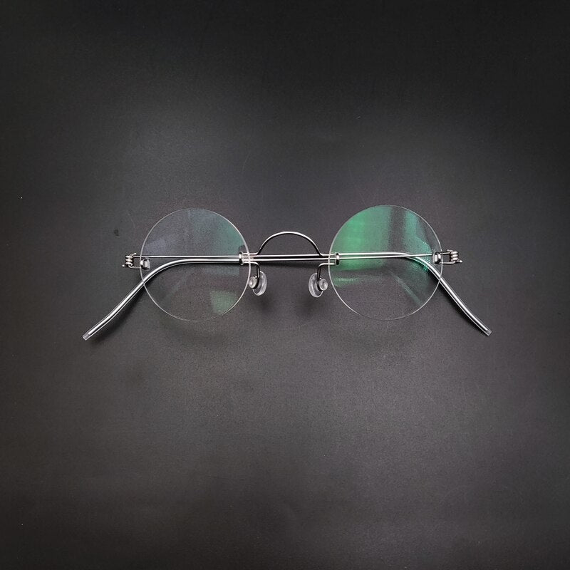 Unisex Handcrafted Round Rimless Steel Frame Eyeglasses Customizable Lenses Rimless Yujo   
